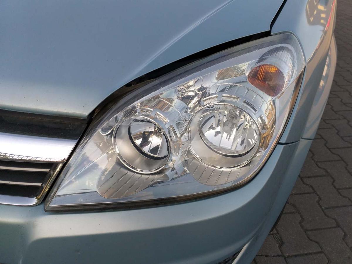 Opel Astra H original Scheinwerfer vorn links Halogen Hintergrund Chrom Facelift Bj.2009